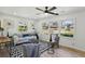 Bright living room with large windows, stylish decor, and comfortable seating, perfect for relaxation at 863 Birch St, Forest Park, GA 30297