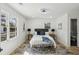 Bright main bedroom features wood-look floors and ensuite bathroom at 863 Birch St, Forest Park, GA 30297