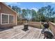 Back deck features bench seating and a grill at 100 Cowan Trl, Stockbridge, GA 30281