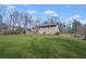 Backyard with a view of the house, deck, and lawn at 100 Cowan Trl, Stockbridge, GA 30281