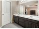 Bathroom features a double sink vanity and a large mirror at 100 Cowan Trl, Stockbridge, GA 30281
