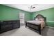 Bedroom features a window, dresser, and queen bed at 100 Cowan Trl, Stockbridge, GA 30281