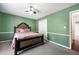 Bedroom with green walls, carpet flooring, ceiling fan, and a closet at 100 Cowan Trl, Stockbridge, GA 30281