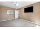 Bedroom with a large TV on the wall, ceiling fan, and map at 100 Cowan Trl, Stockbridge, GA 30281