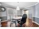 Cozy dining room with hardwood floors, neutral walls and classic trim at 100 Cowan Trl, Stockbridge, GA 30281