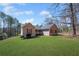 Charming ranch-style home with well-manicured lawn, inviting curb appeal, and a cozy front porch at 100 Cowan Trl, Stockbridge, GA 30281