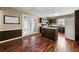Eat-in kitchen features an island, dark cabinets, and doors to the exterior at 100 Cowan Trl, Stockbridge, GA 30281