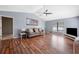 Spacious living room with hardwood floors, vaulted ceiling, and ample natural light at 100 Cowan Trl, Stockbridge, GA 30281