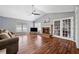 Bright living room with hardwood floors, fireplace, vaulted ceilings, and french doors at 100 Cowan Trl, Stockbridge, GA 30281