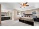 Spacious main bedroom featuring tray ceiling, and large windows at 100 Cowan Trl, Stockbridge, GA 30281