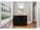 Bathroom with a modern vanity and mirror, enhanced by natural light from the window at 3020 Harold Se Ave, Atlanta, GA 30316