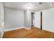 A well-lit bedroom featuring hardwood floors and a closet with sliding doors at 3020 Harold Se Ave, Atlanta, GA 30316