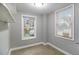 Sunlit bedroom with two windows and neutral-toned walls at 3020 Harold Se Ave, Atlanta, GA 30316