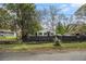 View of a cute home featuring a dark fence, green yard, and driveway at 3020 Harold Se Ave, Atlanta, GA 30316