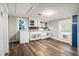 Bright kitchen with white cabinets, wood-look floors, and modern appliances at 3020 Harold Se Ave, Atlanta, GA 30316