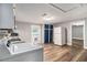 Well-lit kitchen with white appliances, wood-look flooring, blue cabinets and a laundry area at 3020 Harold Se Ave, Atlanta, GA 30316