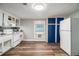 Spacious kitchen featuring white appliances, wood-look flooring and contrasting blue cabinets at 3020 Harold Se Ave, Atlanta, GA 30316