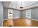 Inviting living room with hardwood floors, decorative lighting, and an open doorway at 3020 Harold Se Ave, Atlanta, GA 30316
