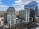 Luxury condos with balconies that offer stunning city views surrounded by other modern towers at 923 Peachtree Ne St # 930, Atlanta, GA 30309
