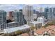 Urban neighborhood featuring a mix of high-rise buildings, green spaces, and tree-lined streets at 923 Peachtree Ne St # 930, Atlanta, GA 30309