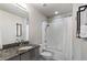 This bathroom features a shower-tub combo with white tiles and updated fixtures at 923 Peachtree Ne St # 930, Atlanta, GA 30309