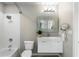 Clean bathroom featuring tub/shower combination and decorative mirror at 923 Peachtree Ne St # 930, Atlanta, GA 30309