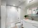 Bright bathroom with white tiled shower and modern vanity at 923 Peachtree Ne St # 930, Atlanta, GA 30309