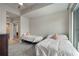 This bedroom has two beds, wood floors, and a bathroom view at 923 Peachtree Ne St # 930, Atlanta, GA 30309