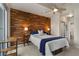 Serene bedroom with striking accent wall and ensuite bathroom at 923 Peachtree Ne St # 930, Atlanta, GA 30309