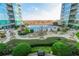 Stunning view of the community pool surrounded by lush landscaping and high-rise buildings in a vibrant setting at 923 Peachtree Ne St # 930, Atlanta, GA 30309