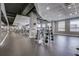 Well-equipped fitness center with modern weightlifting equipment and mirrored walls for a complete workout experience at 923 Peachtree Ne St # 930, Atlanta, GA 30309