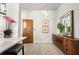 Chic hallway with wood floors, stylish decor, and easy access to the kitchen area at 923 Peachtree Ne St # 930, Atlanta, GA 30309