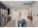 Modern kitchen with stainless steel appliances and oversized island at 923 Peachtree Ne St # 930, Atlanta, GA 30309