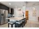 Modern kitchen with stainless steel appliances and oversized island at 923 Peachtree Ne St # 930, Atlanta, GA 30309