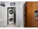 Convenient laundry closet with stacked washer and dryer at 923 Peachtree Ne St # 930, Atlanta, GA 30309