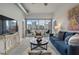 Inviting living room featuring a large window with city views at 923 Peachtree Ne St # 930, Atlanta, GA 30309