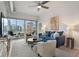 Cozy living room with a comfortable blue sofa, stylish decor, and a balcony overlooking the city at 923 Peachtree Ne St # 930, Atlanta, GA 30309