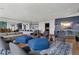 Club lounge with comfortable seating, stylish decor, and a view of the community amenities at 923 Peachtree Ne St # 930, Atlanta, GA 30309