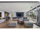 Modern resident lounge featuring stylish furniture, a tv, and views of the outdoor patio at 923 Peachtree Ne St # 930, Atlanta, GA 30309