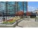 Beautifully landscaped terrace features colorful flowerbeds and seating areas for enjoying serene views in an urban setting at 923 Peachtree Ne St # 930, Atlanta, GA 30309