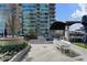 Relaxing rooftop deck featuring comfortable seating, outdoor dining, and lush greenery, perfect for entertaining guests at 923 Peachtree Ne St # 930, Atlanta, GA 30309
