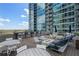 Inviting rooftop deck with cozy fire pit, stylish seating, and bar area offering an ideal space for social gatherings at 923 Peachtree Ne St # 930, Atlanta, GA 30309