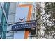 Metropolis building signage with modern design against the building's exterior at 923 Peachtree Ne St # 930, Atlanta, GA 30309