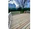 A wood deck with wood railings overlooks the landscaped backyard and foliage at 971 Martin Se St, Atlanta, GA 30315