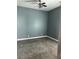 Bedroom features neutral walls, carpet flooring, and ceiling fan with lighting at 971 Martin Se St, Atlanta, GA 30315