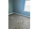 Bright bedroom featuring neutral walls and plush carpeting with a window at 971 Martin Se St, Atlanta, GA 30315