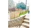 Stone staircase leads up to a wood fence, adding privacy to the property at 971 Martin Se St, Atlanta, GA 30315