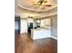 Open kitchen with an island, ceiling fan, granite counters, and hardwood floors at 971 Martin Se St, Atlanta, GA 30315