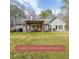 Backyard featuring a covered patio area perfect for outdoor living and entertaining at 4751 Bill Cheek Rd, Auburn, GA 30011