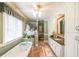 Bathroom with white cabinets, granite countertops, a soaking tub, and tile flooring at 4751 Bill Cheek Rd, Auburn, GA 30011